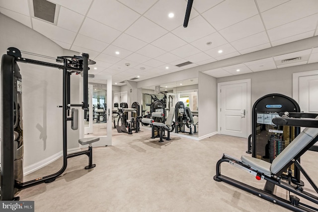 workout area with light carpet and a drop ceiling