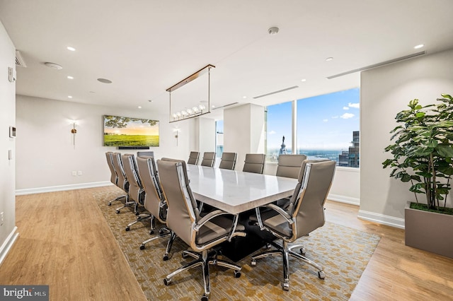 dining space with light hardwood / wood-style flooring