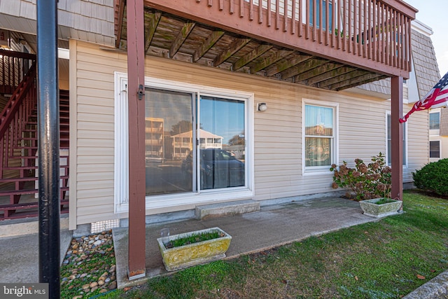 view of side of home featuring a patio area