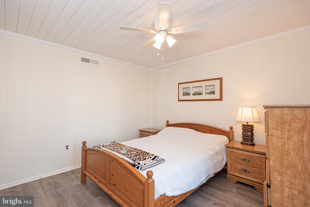 bedroom with ornamental molding, dark hardwood / wood-style floors, ceiling fan, and wood ceiling