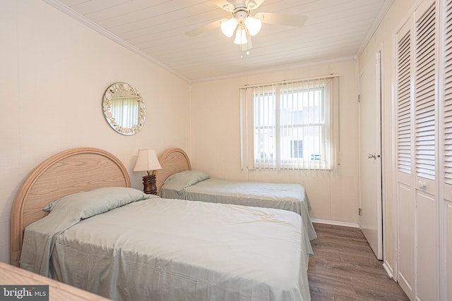 bedroom featuring ceiling fan, wooden ceiling, wood-type flooring, and crown molding