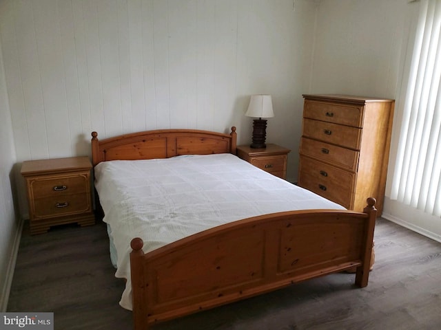 bedroom featuring dark hardwood / wood-style flooring