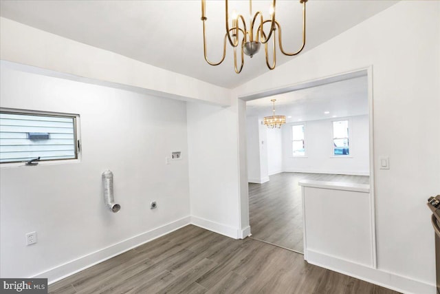 laundry room with dark hardwood / wood-style floors, a chandelier, and hookup for an electric dryer