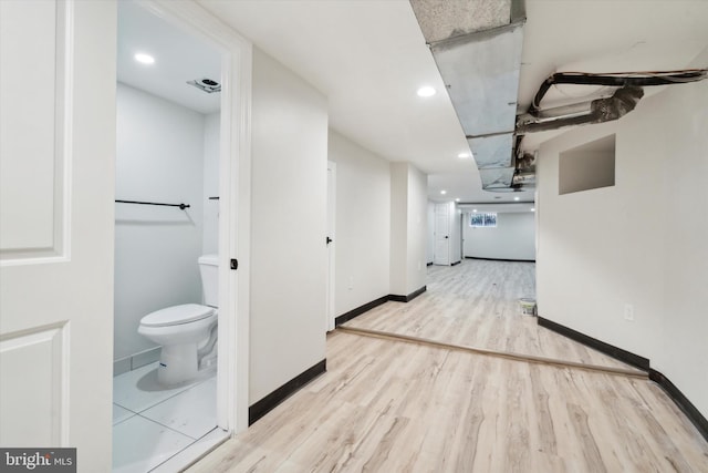 basement featuring light wood-type flooring