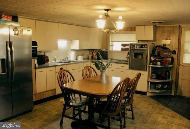 interior space with sink and a notable chandelier