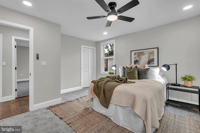 bedroom with a closet, ceiling fan, and carpet flooring