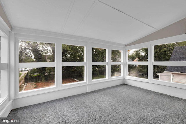 unfurnished sunroom featuring vaulted ceiling