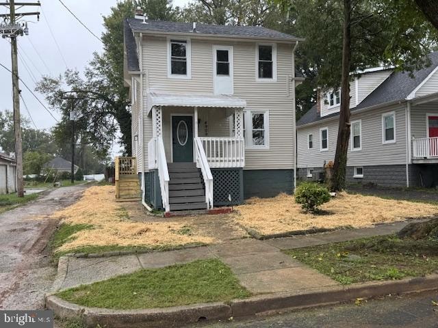 view of front of home featuring covered porch and central AC unit