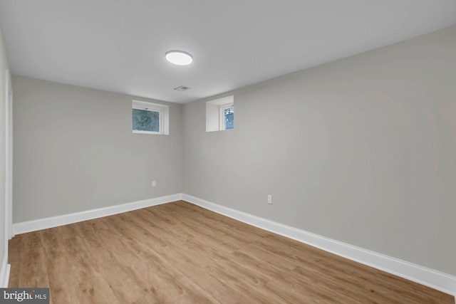 basement featuring light hardwood / wood-style floors