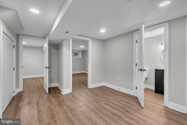 basement featuring light hardwood / wood-style floors