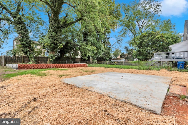 view of yard with a patio area and a deck