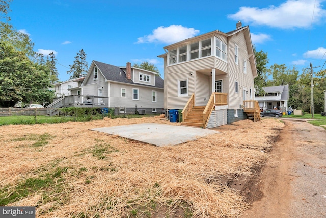 back of property featuring central AC unit