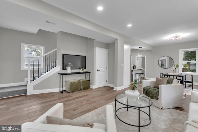 living room featuring light hardwood / wood-style flooring and a wealth of natural light