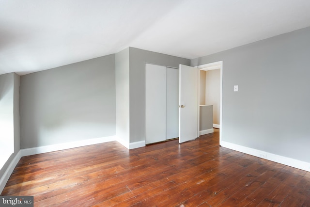 additional living space with dark hardwood / wood-style floors