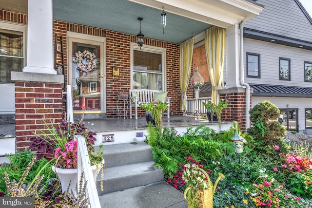 property entrance with covered porch