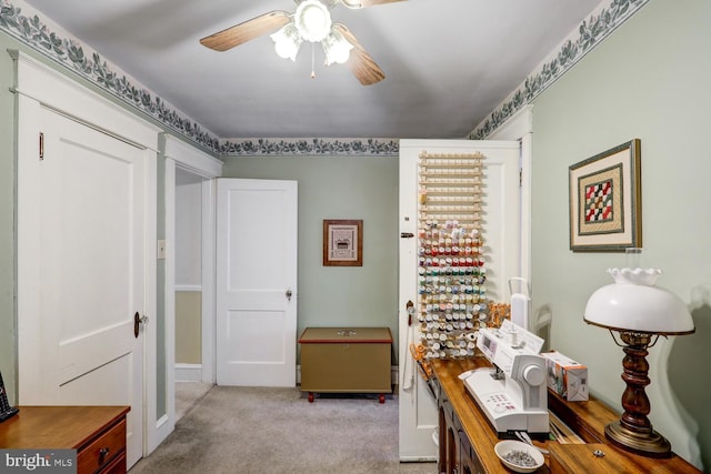 office with light carpet and ceiling fan