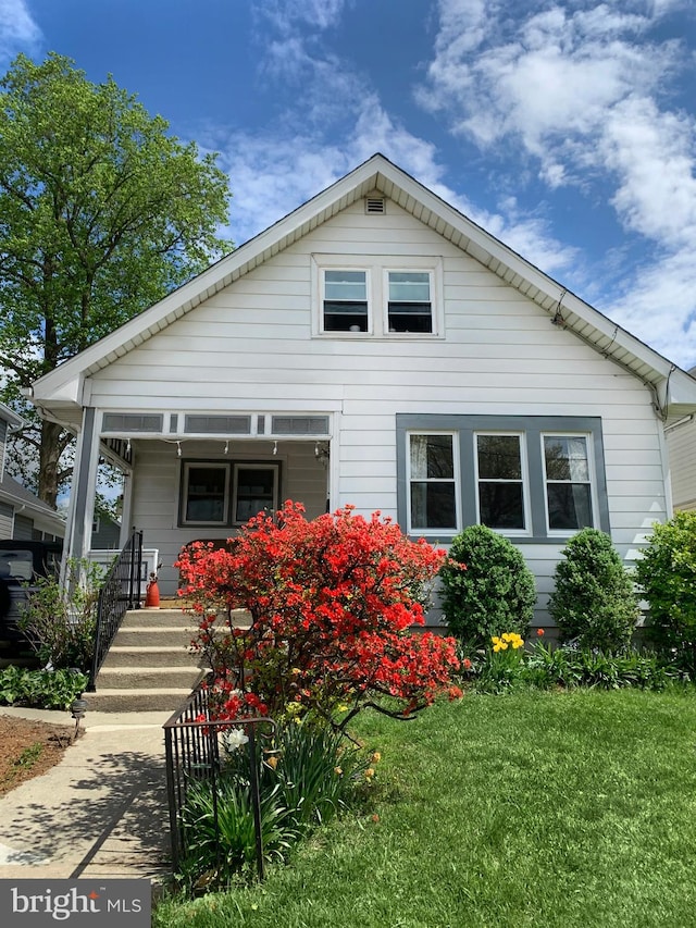 bungalow with a front lawn