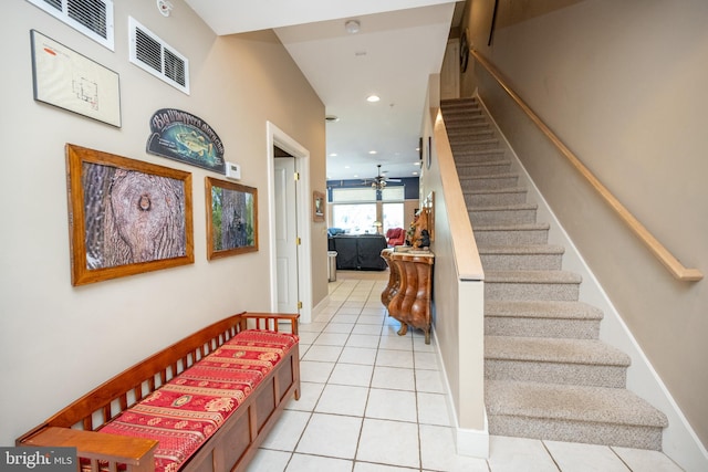 staircase featuring tile patterned flooring