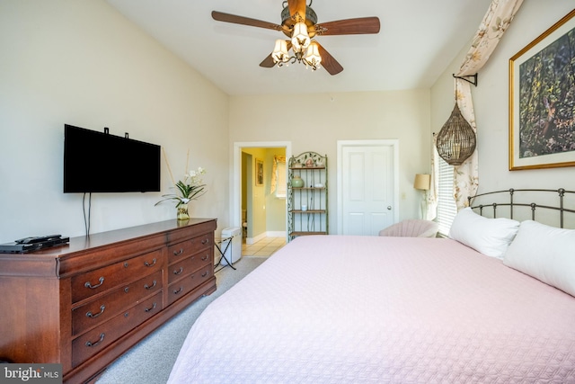 bedroom with ceiling fan and light colored carpet