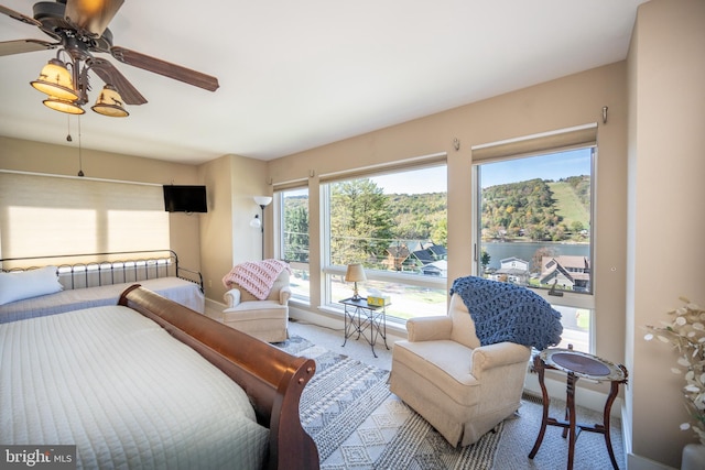 bedroom with ceiling fan and carpet flooring