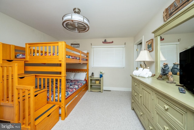 bedroom with light colored carpet