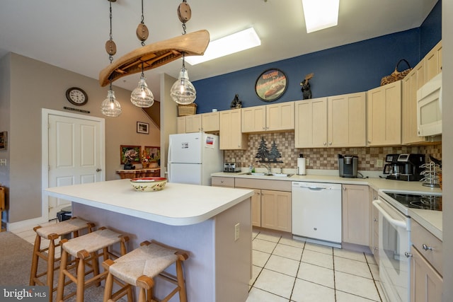 kitchen with pendant lighting, sink, white appliances, backsplash, and light tile patterned floors