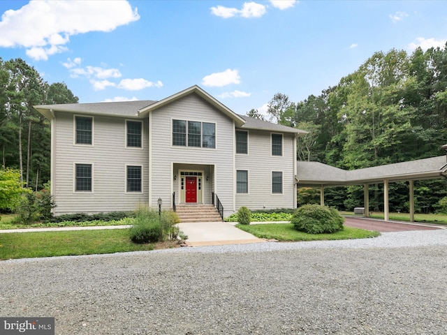 view of front of house with a carport