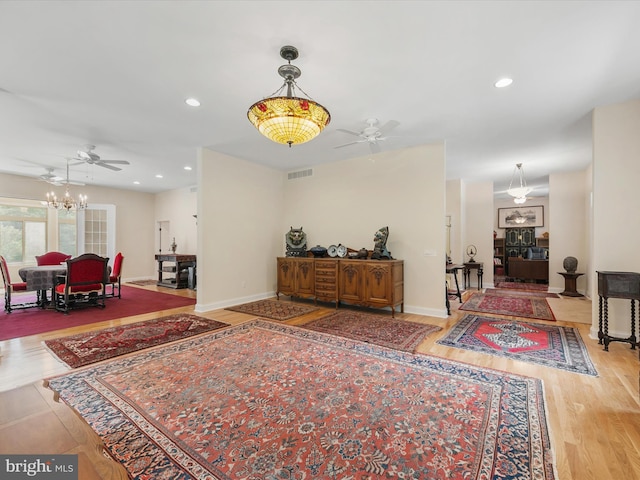 interior space featuring wood-type flooring and an inviting chandelier