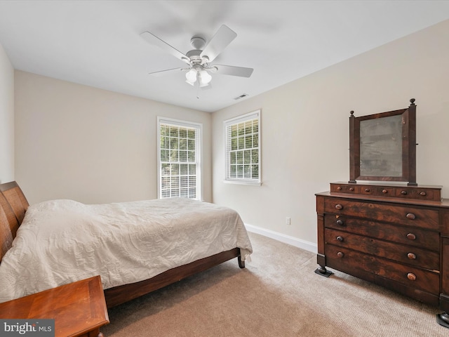 bedroom with light colored carpet and ceiling fan