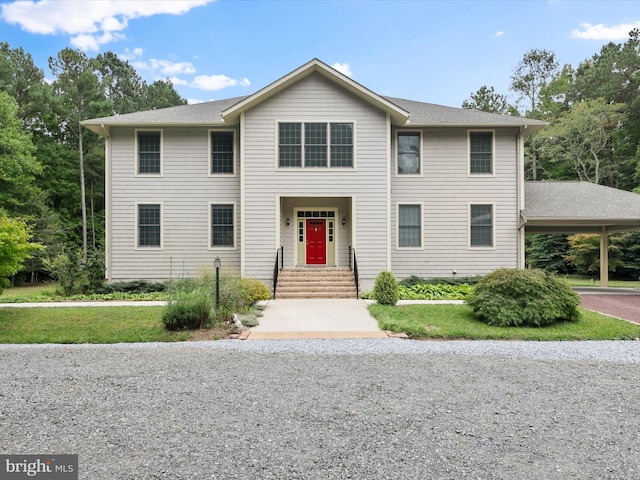 view of front of home featuring a carport