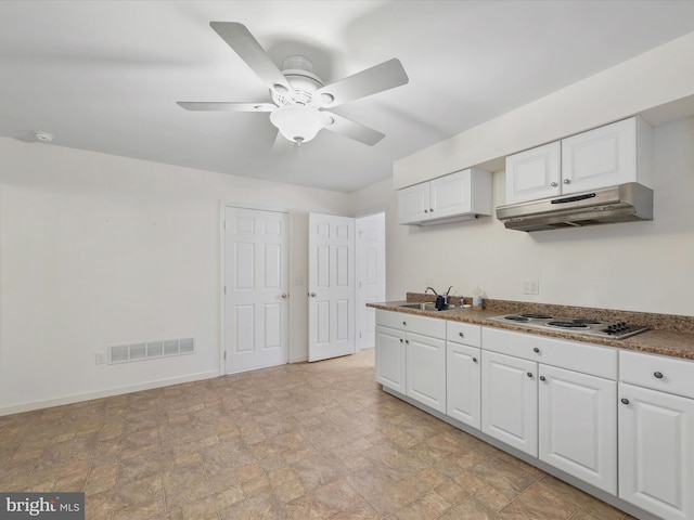 kitchen with white cabinets, ceiling fan, white gas cooktop, and sink