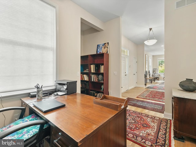 office space featuring light wood-type flooring