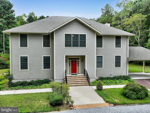 view of front of property with a carport