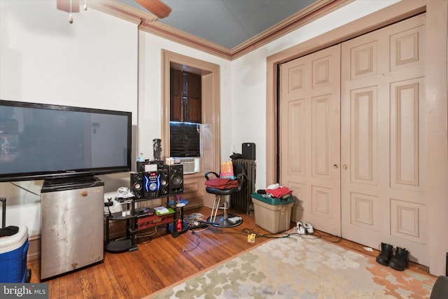 interior space featuring ornamental molding and hardwood / wood-style floors