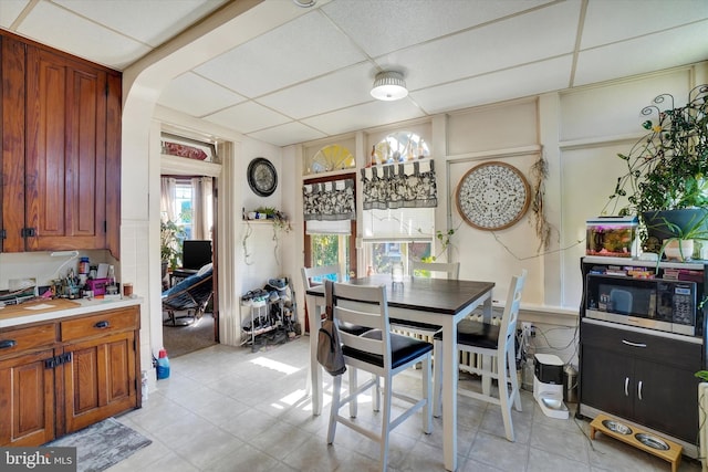 dining room featuring a paneled ceiling