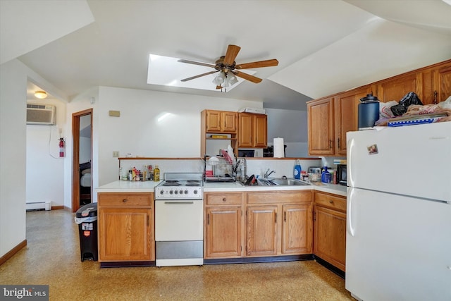 kitchen with white appliances, baseboard heating, ceiling fan, sink, and an AC wall unit