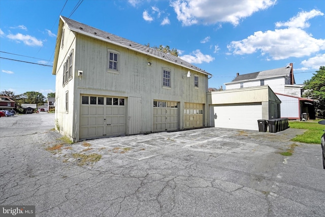 view of property exterior featuring a garage