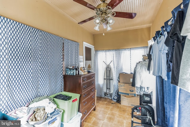 walk in closet with ceiling fan