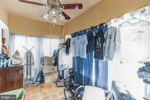 interior space with tile patterned flooring and ceiling fan