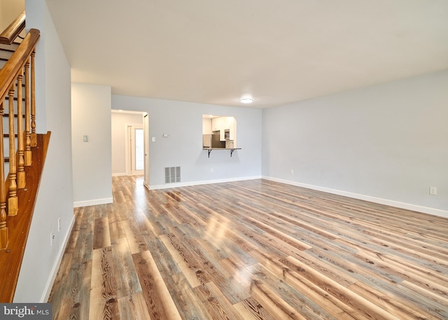 unfurnished living room featuring light hardwood / wood-style flooring