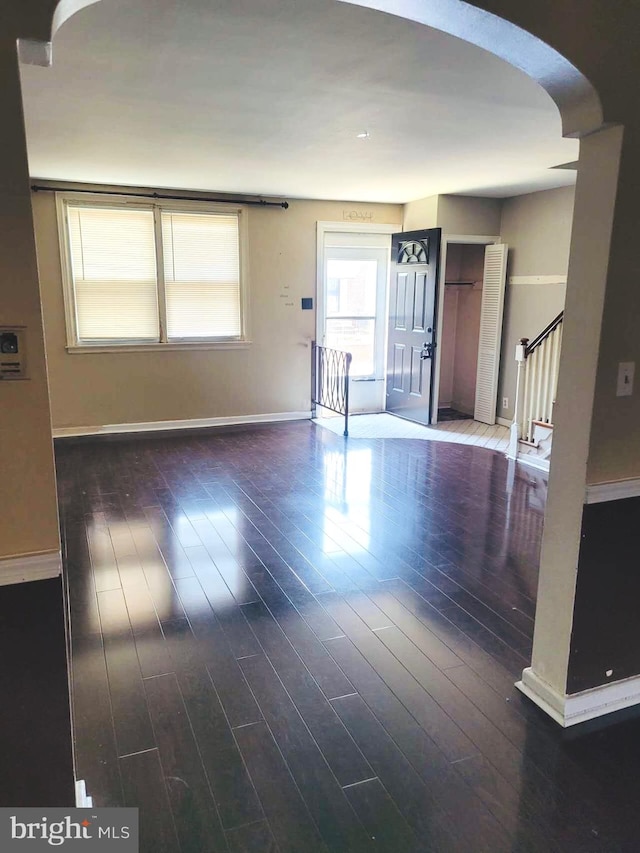 spare room featuring dark hardwood / wood-style flooring