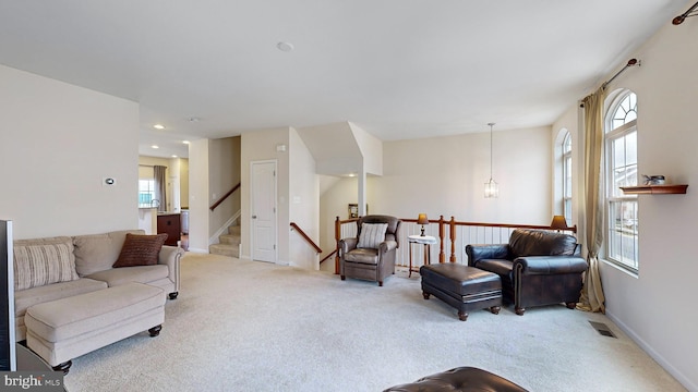 carpeted living room with plenty of natural light