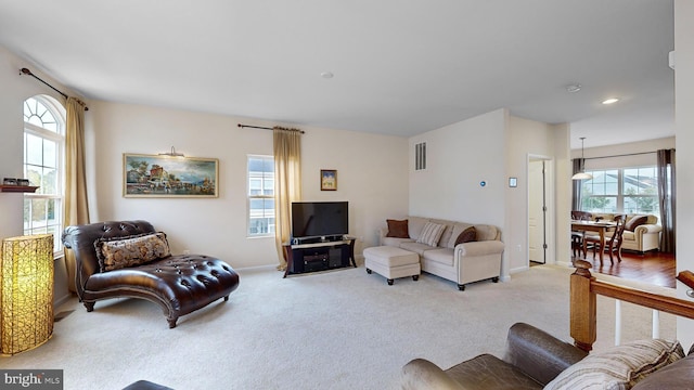 living room featuring light colored carpet