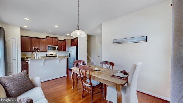 dining area featuring dark hardwood / wood-style flooring