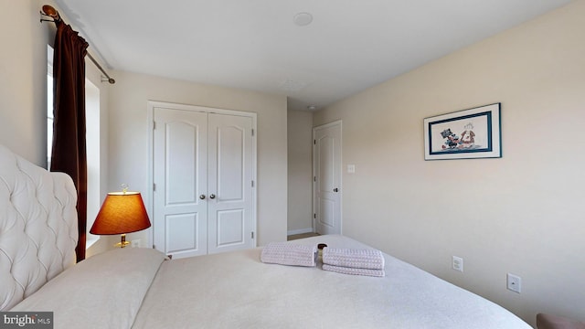 bedroom featuring a closet and carpet floors