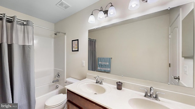 full bathroom with shower / bathtub combination with curtain, toilet, and vanity