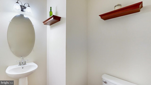 bathroom with sink and toilet