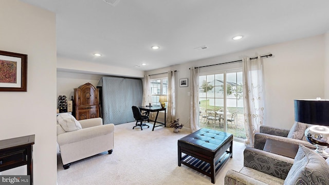 living room with light colored carpet