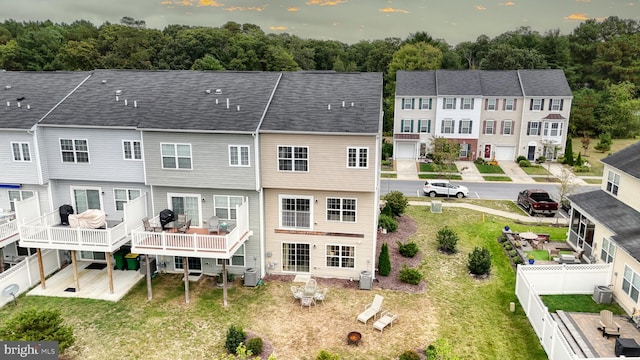 rear view of property featuring a deck