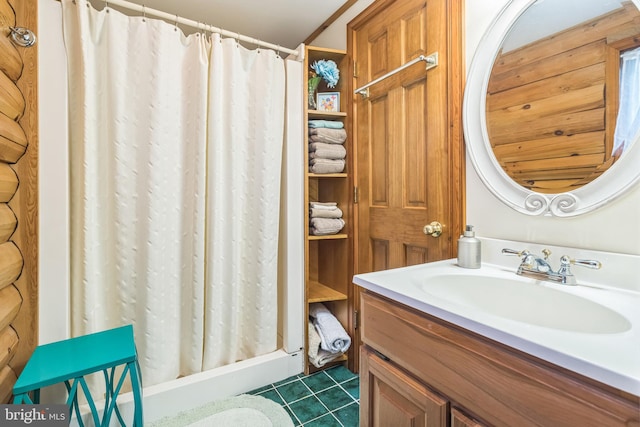 bathroom featuring vanity, tile patterned flooring, and curtained shower